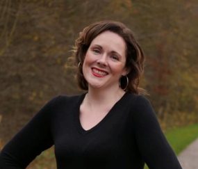 Alison Brain smiles in a headshot image