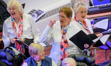 Performers and participants taking part in music making