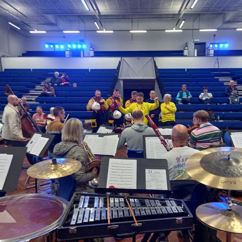 Members from the lifeboat team singing with musicians