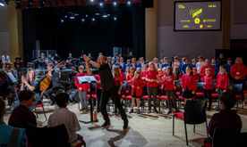A large scale orchestral performance with students and musicians