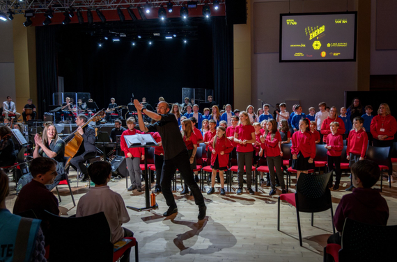 A large scale orchestral performance with students and musicians