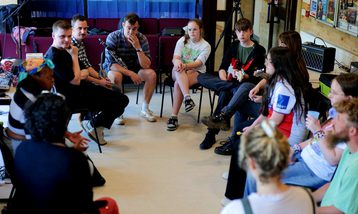 A group of young people in a music workshop