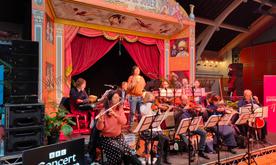 A small group of musicians performing on stage