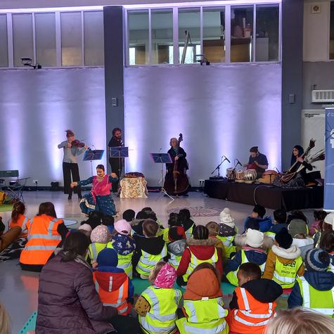 Group of school children watching a performance