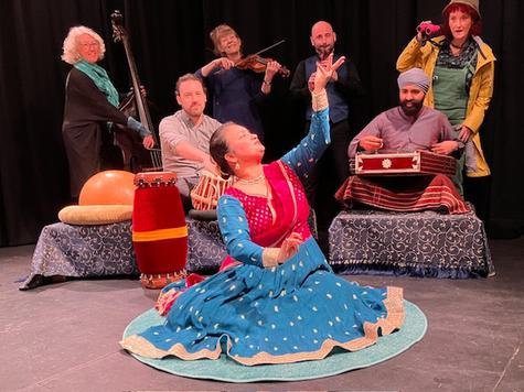 A group of people sitting on a stage.