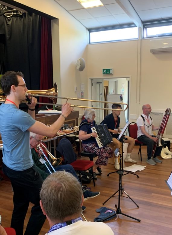 A music workshop with musicians playing various instruments
