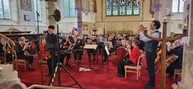 A group of musicians playing in a church building
