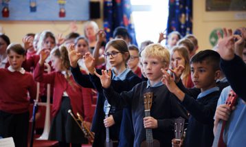 Group of school children singing