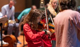 Student playing a violin