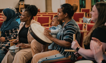 Close up of group of women playing instruments