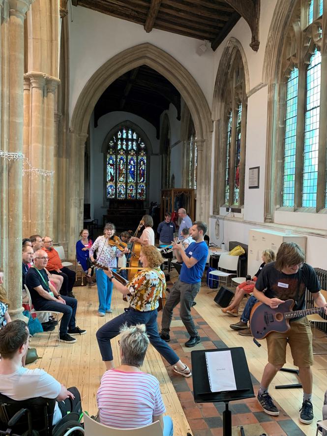 A group of people dancing and making music
