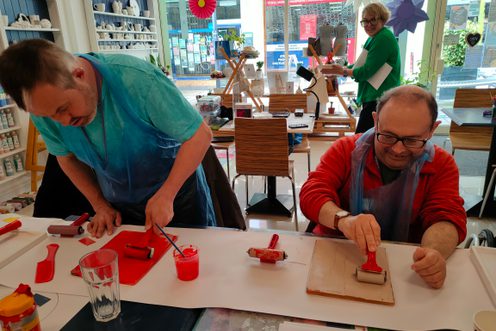 Two people taking part in a craft activity