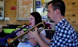 Two young people playing instruments
